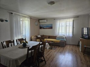Apartment (Three Bedroom Apartment (A6)) | Living room | 32-inch flat-screen TV with cable channels - Holiday Home Green Oasis Lika (Lovinac)