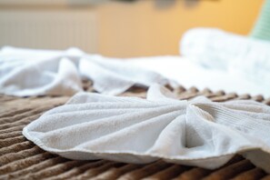 A textured surface with a white, pleated fabric item. - Stylish 2BR Jewellery Quarter Apt, Sleeps 4 (Birmingham)