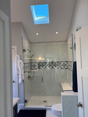 Shower, hair dryer, towels, soap