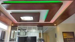 A modern kitchen with a central island, recessed lighting, and a skylight. - Entire rental unit - bright space and a magnificent overlooking view of area. (San Jose del Monte)