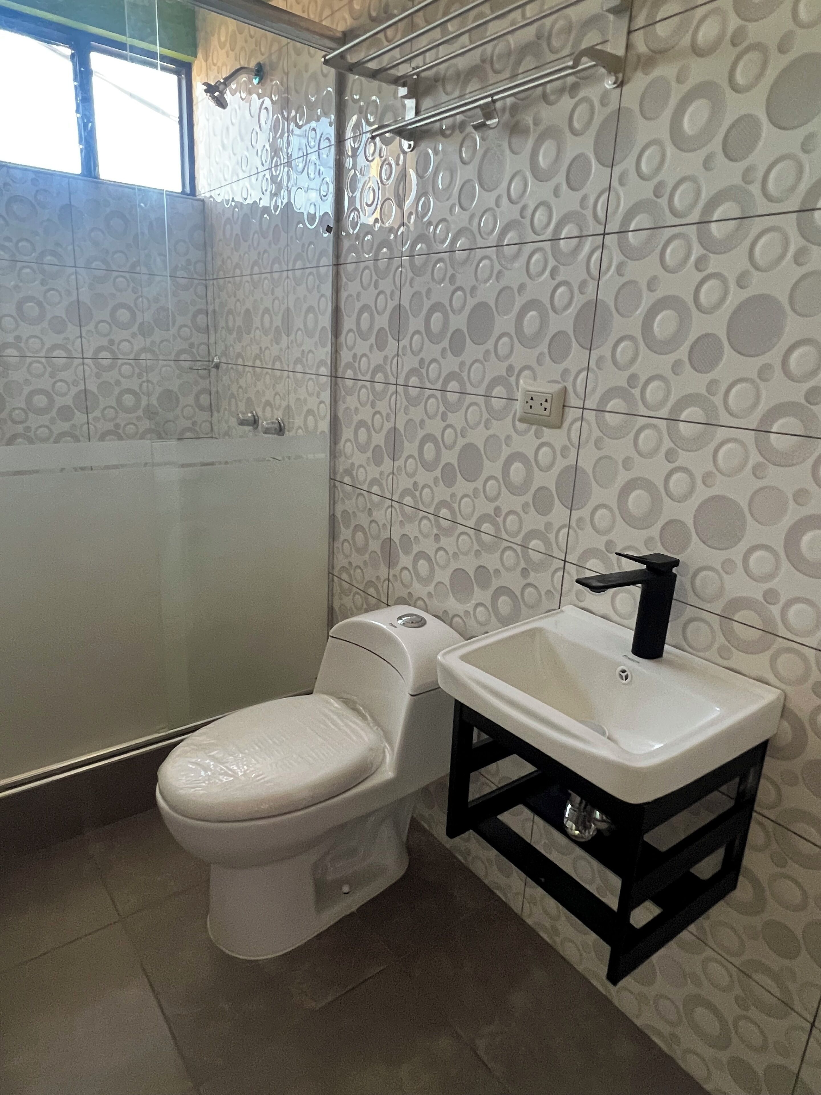 Shower, towels, soap, toilet paper