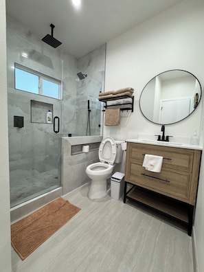 Shower, hair dryer, towels, soap