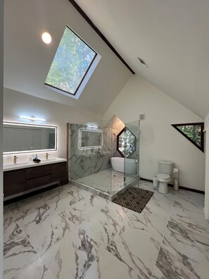 Shower, hair dryer, towels, soap