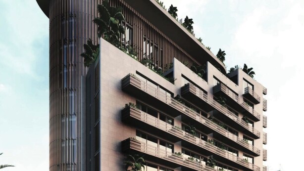 A multi-story hotel with balconies, a curved corner design, and a mix of indoor and outdoor spaces. - Full Service Apartment in Cantonments, Accra. (Accra)