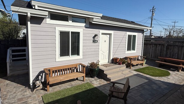 A single-story house with a front porch, a mailbox, and a number sign. - Private and charming Bay Area home. Centrally located to all Bay Area cities! (South San Francisco)