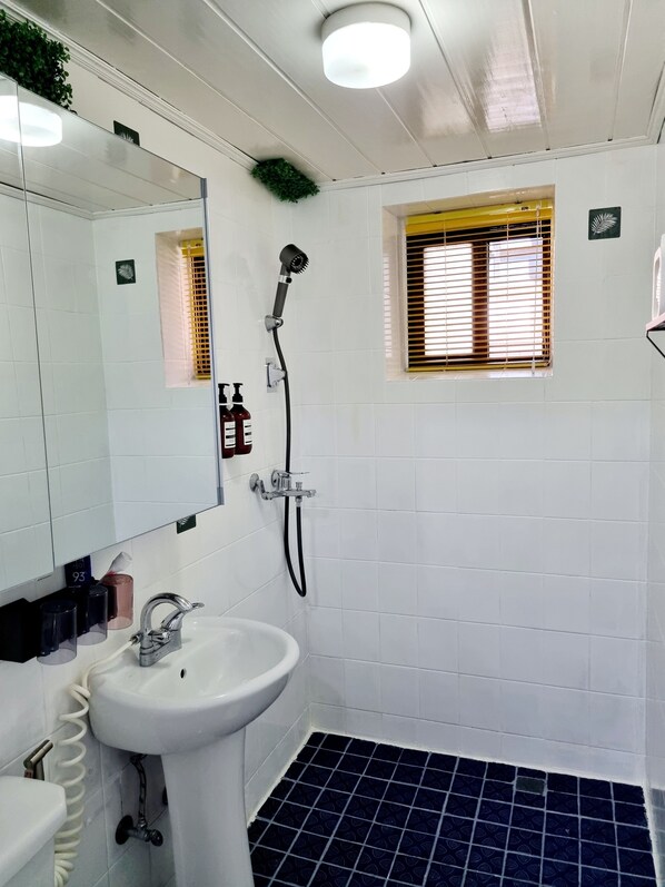 Standard Apartment, 2 Bedrooms (non-Korean nationals only) | Bathroom | Shower, hair dryer, slippers, towels