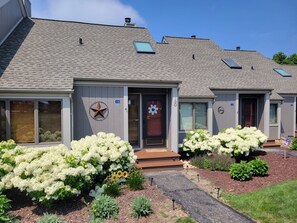 A residential building with a grey facade, a star-shaped decoration, and a number '130' on the door. - 2 Bedroom +Loft, 2 bath townhouse in The Galena Territory (Galena)