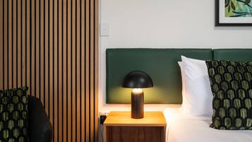 Desk, laptop workspace, blackout drapes, iron/ironing board