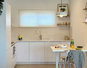 Fridge, microwave, stovetop, coffee/tea maker