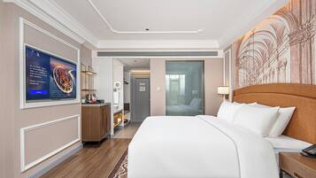 Habitación Deluxe doble | Minibar y ropa de cama