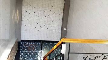 Desk, laptop workspace, blackout drapes, iron/ironing board