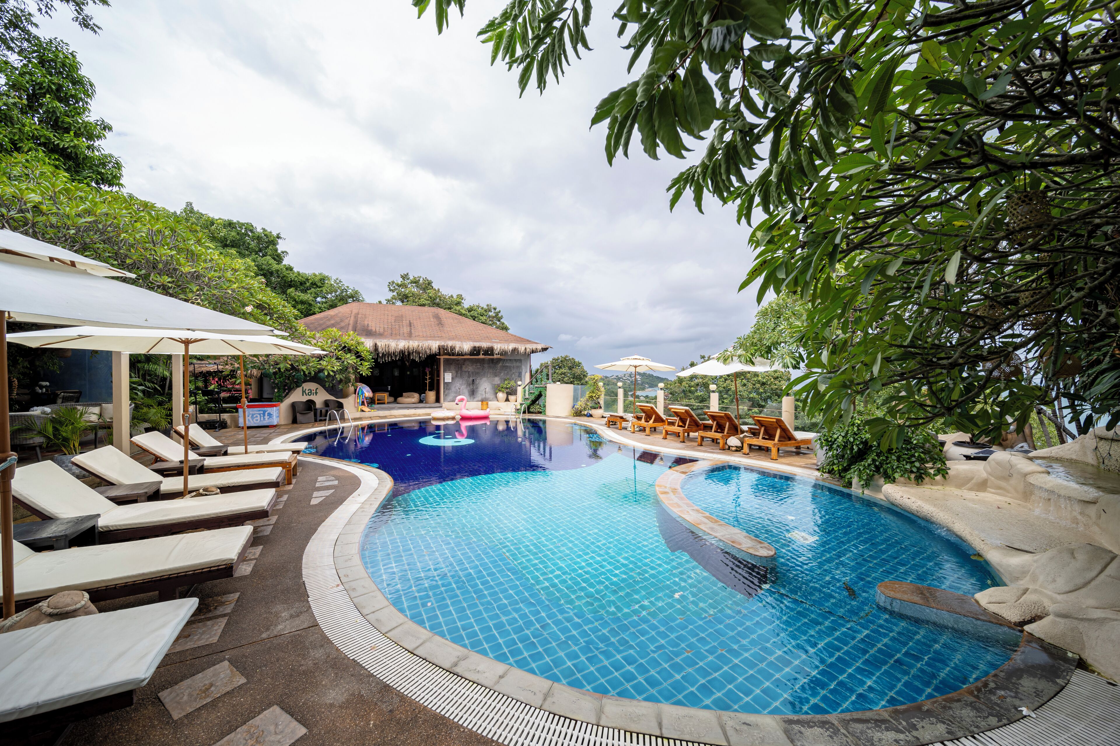 Outdoor pool, open 10:00 AM to 10:00 PM, pool umbrellas, pool loungers