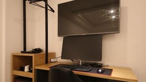A desk with a computer, keyboard, mouse, and a chair. - Business Hotel J7 Busan (Busan)