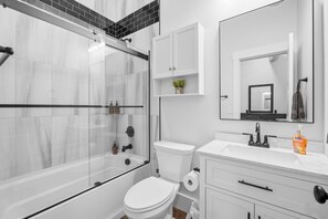 Shower, towels, soap, toilet paper