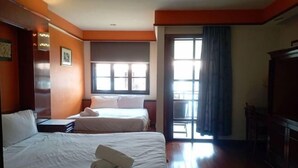 A hotel room with two beds, a large window, and a view of the outside. - Premium Water Chalet 2 (Port Dickson)