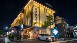 A modern building with a sign reading 'PALETTE' and a parked car in front. - Palette Hotel near Padma (Legian)
