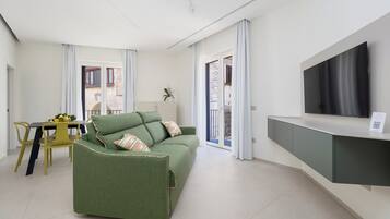 Luxury Suite, Balcony, City View | Living area | 46-inch Smart TV with digital channels, Netflix, streaming services