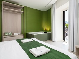 Luxury Suite, Balcony, City View | Desk, laptop workspace, soundproofing, free WiFi