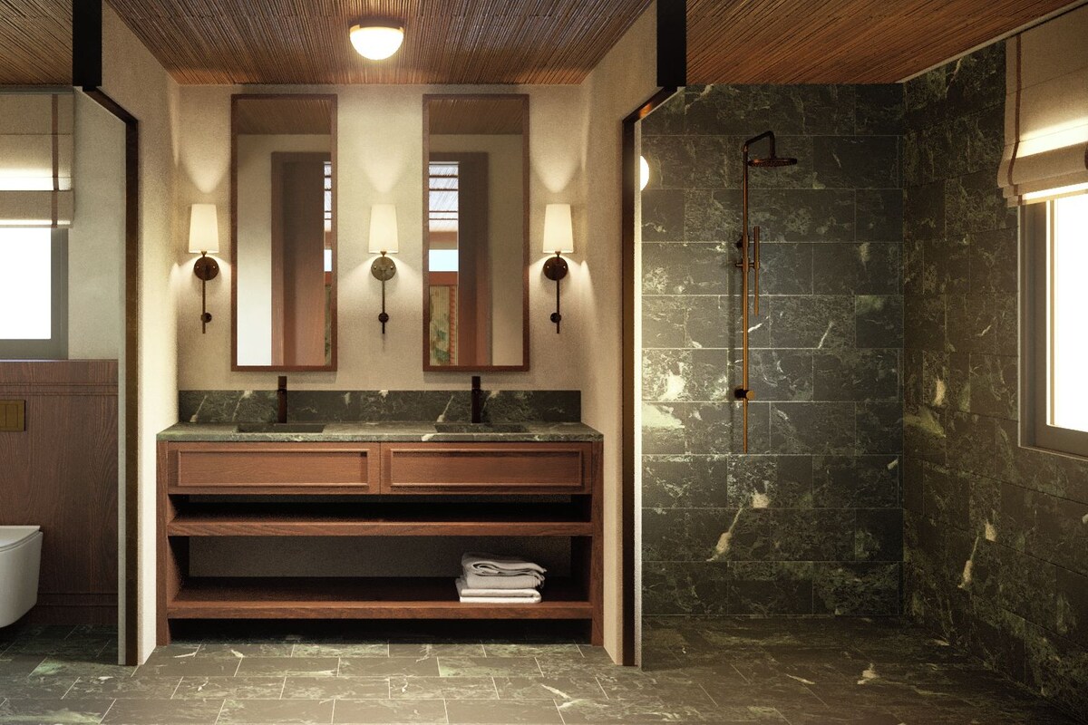 A modern bathroom with a wooden vanity, a built-in toilet, and a shower with dark stone tiles.