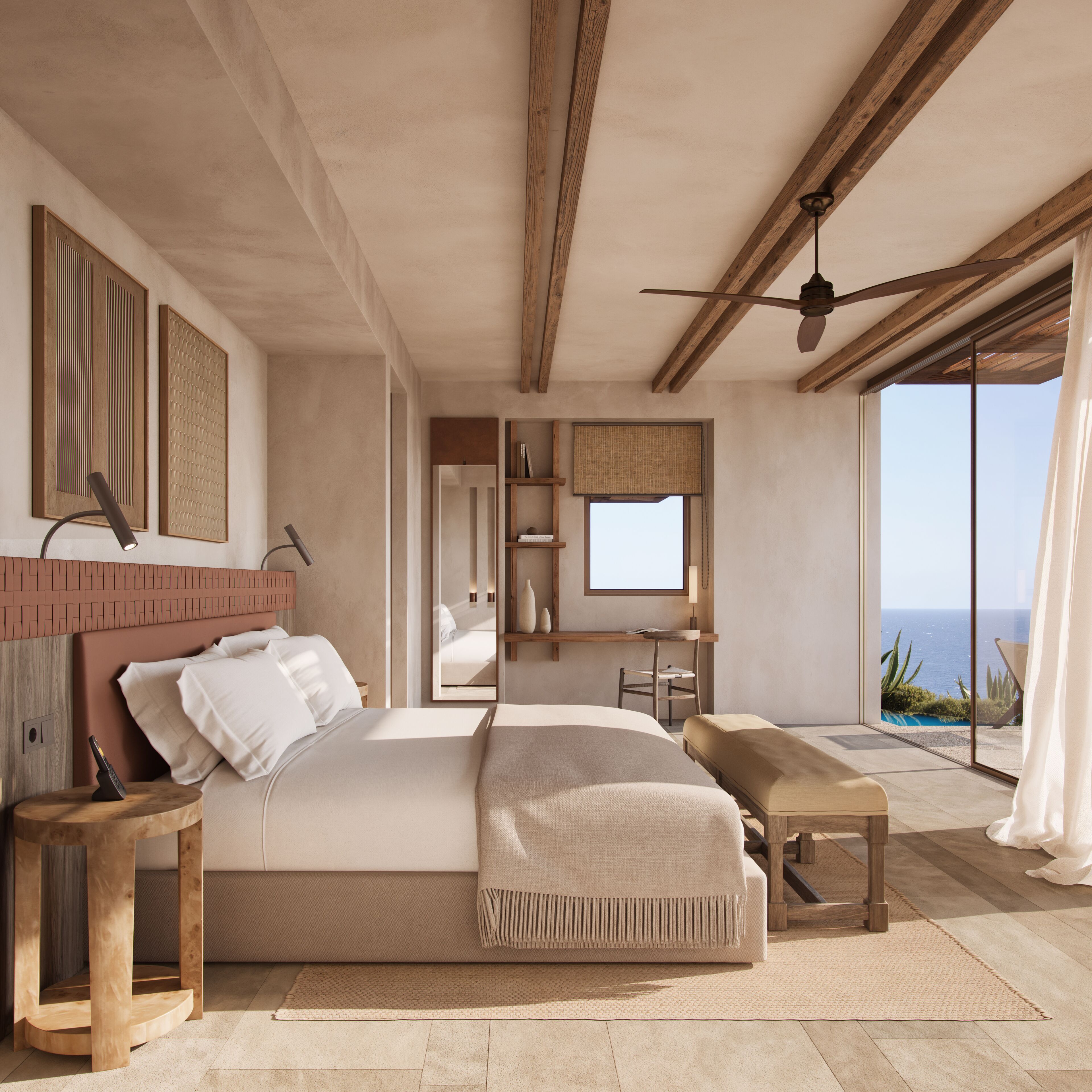 Quarto moderno com uma cama grande, uma escrivaninha e vista para o oceano.