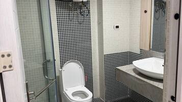 Shower, slippers, towels, soap