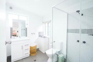 Shower, hair dryer, towels, soap