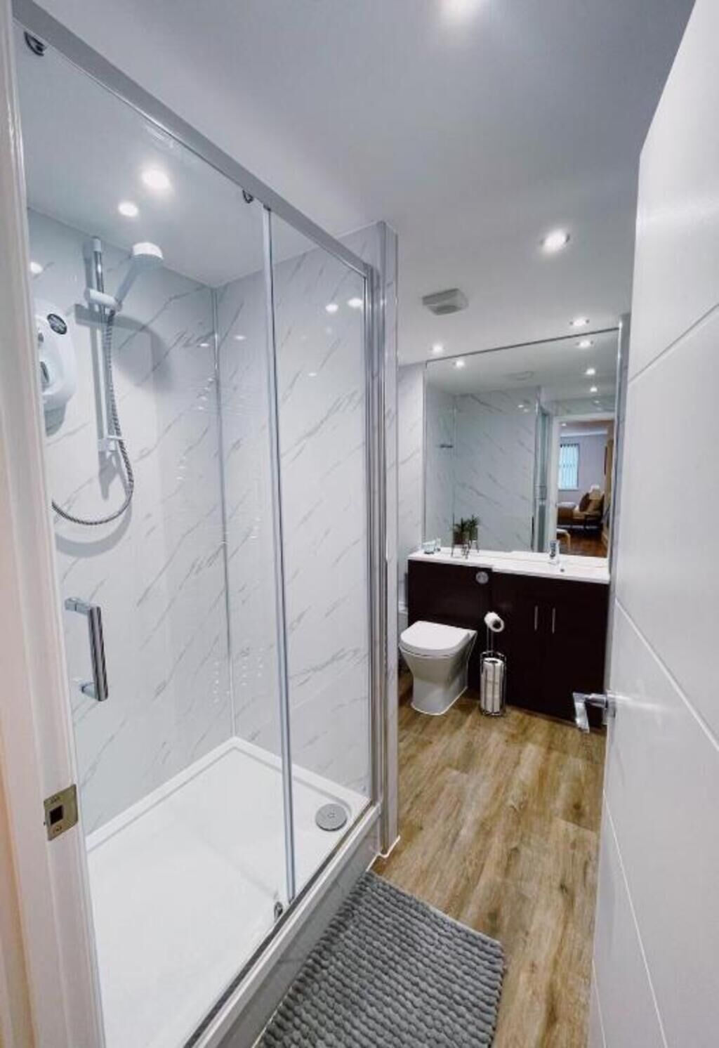 Shower, hair dryer, towels, toilet paper
