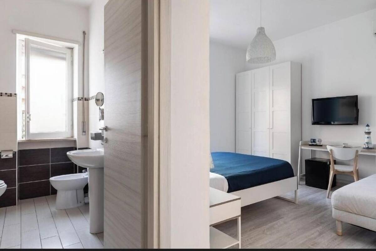 Standard Triple Room | Blackout drapes, iron/ironing board, free WiFi