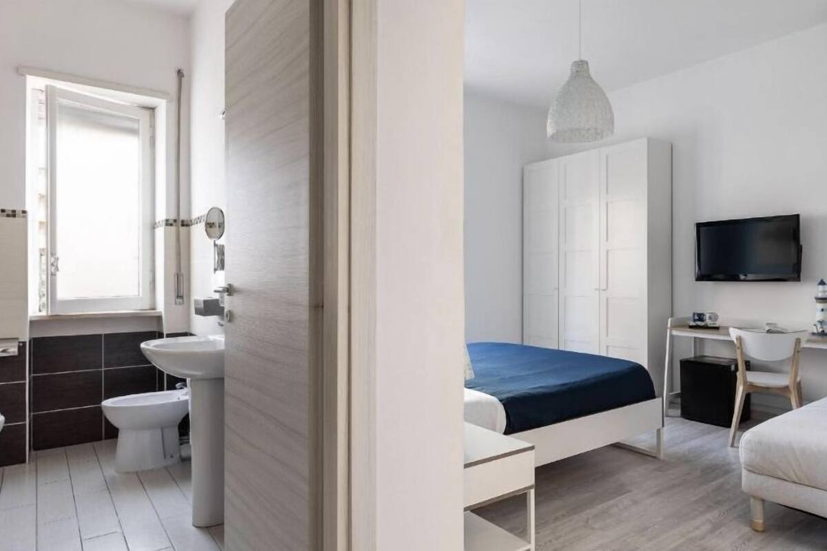 Standard Triple Room | Blackout drapes, iron/ironing board, free WiFi