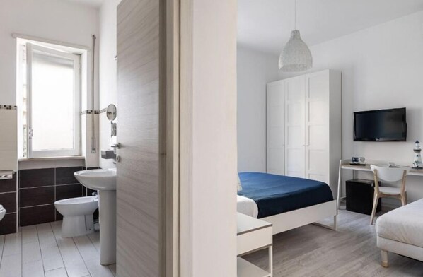 Standard Triple Room | Blackout drapes, iron/ironing board, free WiFi