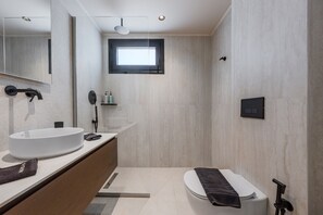 A modern bathroom with a large sink, toilet, and a window. - Nysa Luxury Villa 5 ,Private Pool near Hersonissos (Heraklion)