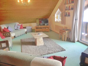 Apartment, 1 Bedroom, Balcony, Garden View | Living room | Books - Spacious Apartment in an Ideal Location With Private Balcony and Mountain Views (Sankt Michael im Lungau)