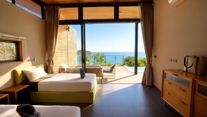 A hotel room with a balcony, a bed, a desk, and a dresser. - Yume 17 Sea View Villas (Ko Pha-ngan)