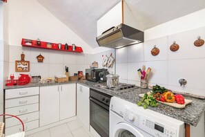 Standard Apartment, 1 Bedroom (Il Balcone Sulle Alpi ski in ski out) | Private kitchen | Fridge, oven, stovetop, coffee/tea maker