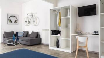 Luxury Quadruple Room, Balcony | In-room safe, desk, soundproofing, iron/ironing board