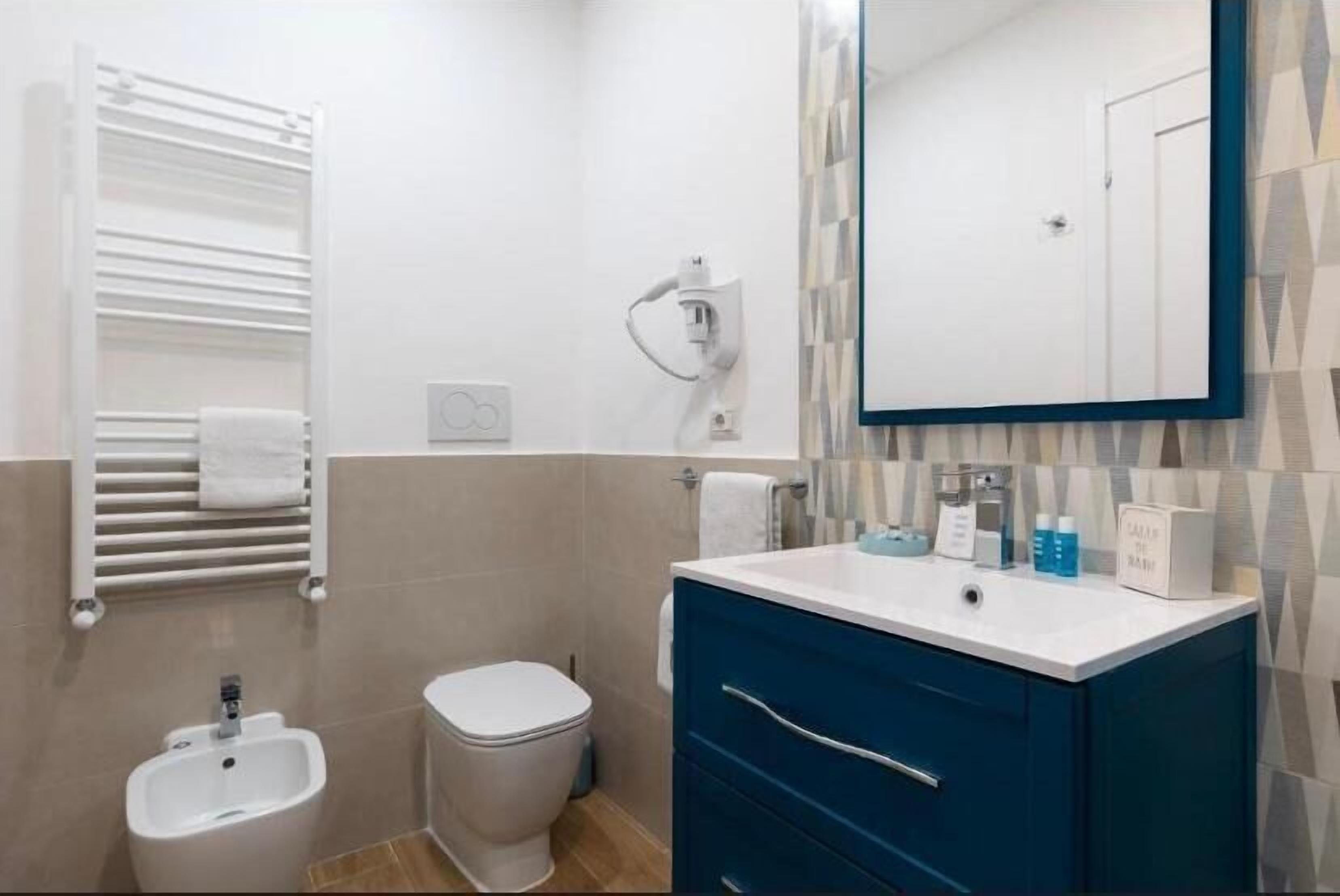 Deluxe Double Room, Balcony, City View | Bathroom | Shower, hair dryer, towels, soap