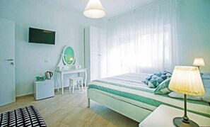 Deluxe Double Room, Balcony, Courtyard View | In-room safe, soundproofing, iron/ironing board, free WiFi