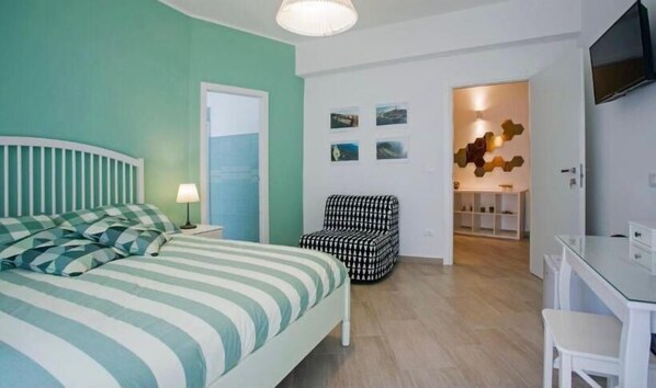 Deluxe Double Room, Balcony, Courtyard View | In-room safe, soundproofing, iron/ironing board, free WiFi