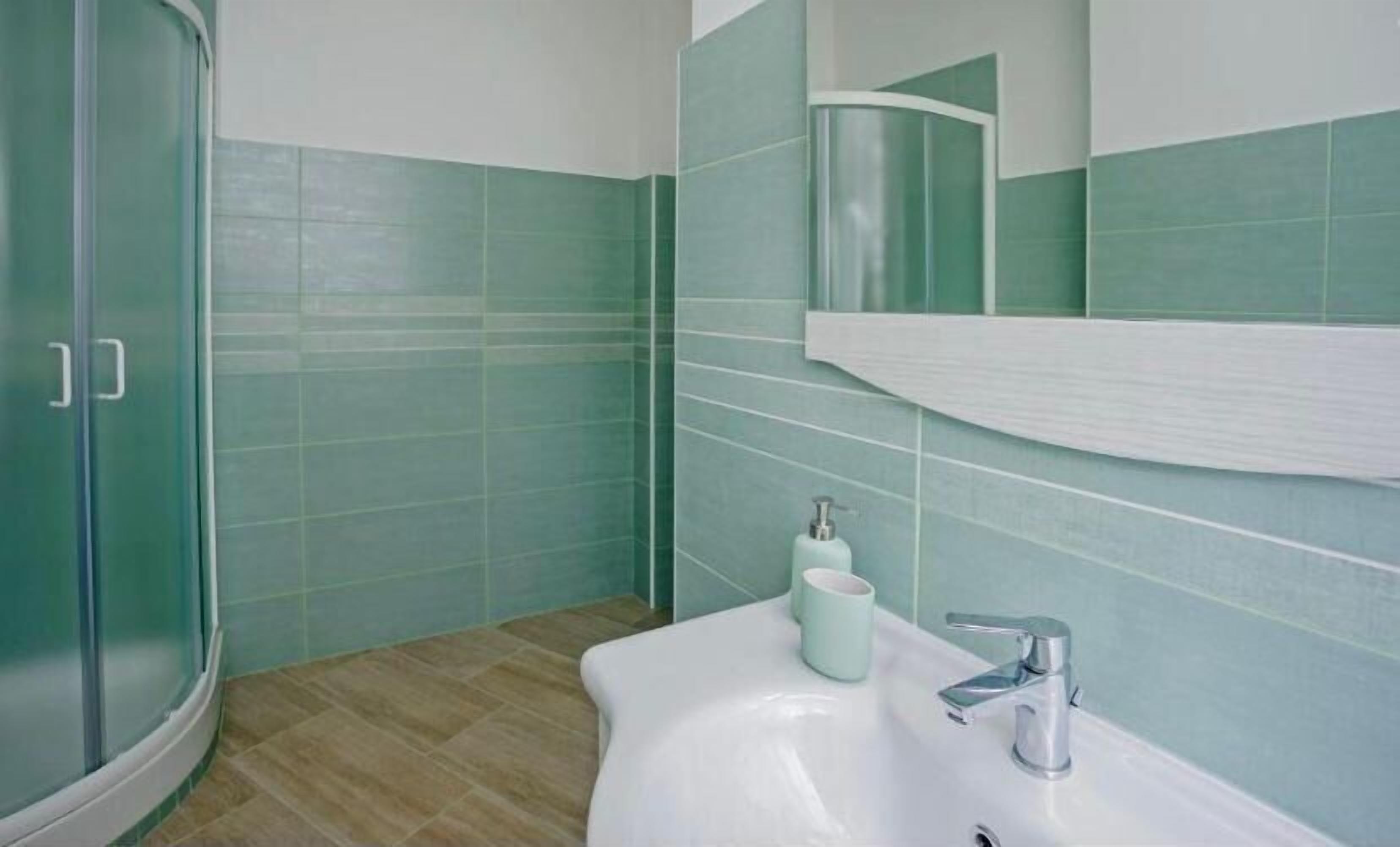 Deluxe Double Room, Balcony, Courtyard View | Bathroom | Bathrobes