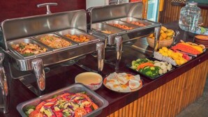 A buffet with various food options including salads, fried items, and fruits. - Vientiane Ruby Riverside Hotel & Hostel (Vientiane)