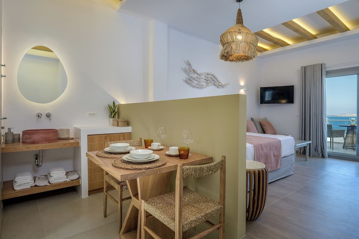 Deluxe Suite, Balcony, Ocean View | Desk, blackout curtains, soundproofing, iron/ironing board