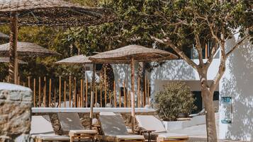 Seasonal outdoor pool, open 10:00 AM to 7:00 PM, pool umbrellas