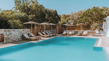 Seasonal outdoor pool, open 10:00 AM to 7:00 PM, pool umbrellas