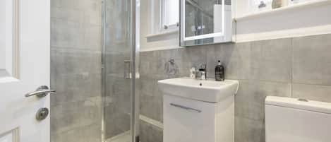 Shower, hair dryer, towels, soap