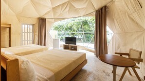 A tented accommodation with two beds, a television, and a dining area. - Bubble Glamping, Family 2 Beds, we Have a 12 Units Like This! (Sosúa)