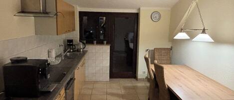 Fridge, stovetop, dishwasher, coffee/tea maker