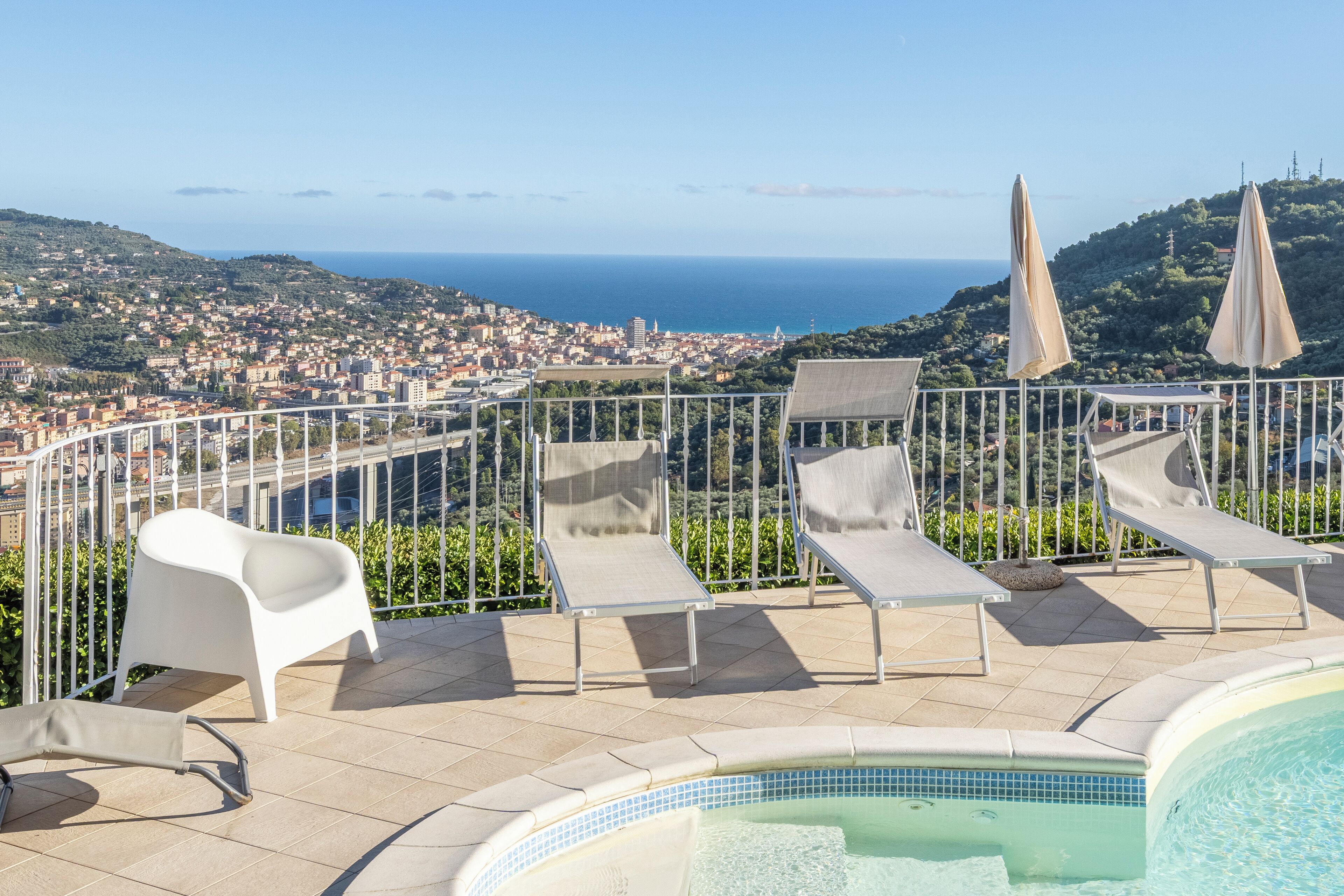 Seasonal outdoor pool, pool umbrellas, pool loungers