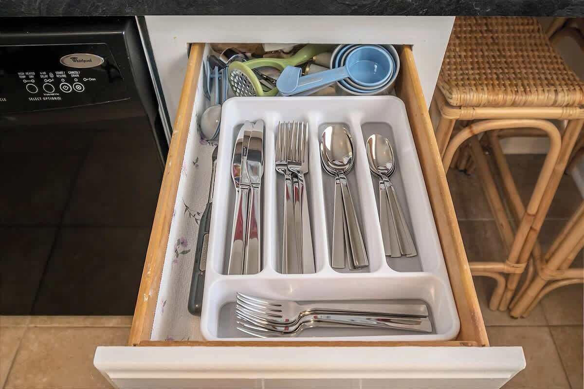 A kitchen drawer with utensils neatly organized.