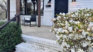 A house with a porch, a mailbox, and a door number 1231. - Hidden Getaway | Fire Pit | 1K,2Q/1 bath (Eden)