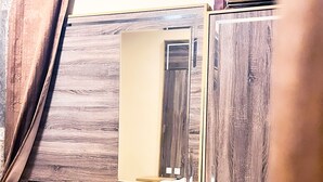A mirror with a wooden frame, a wooden desk, and a small stool. - Alora Zone (Abha)